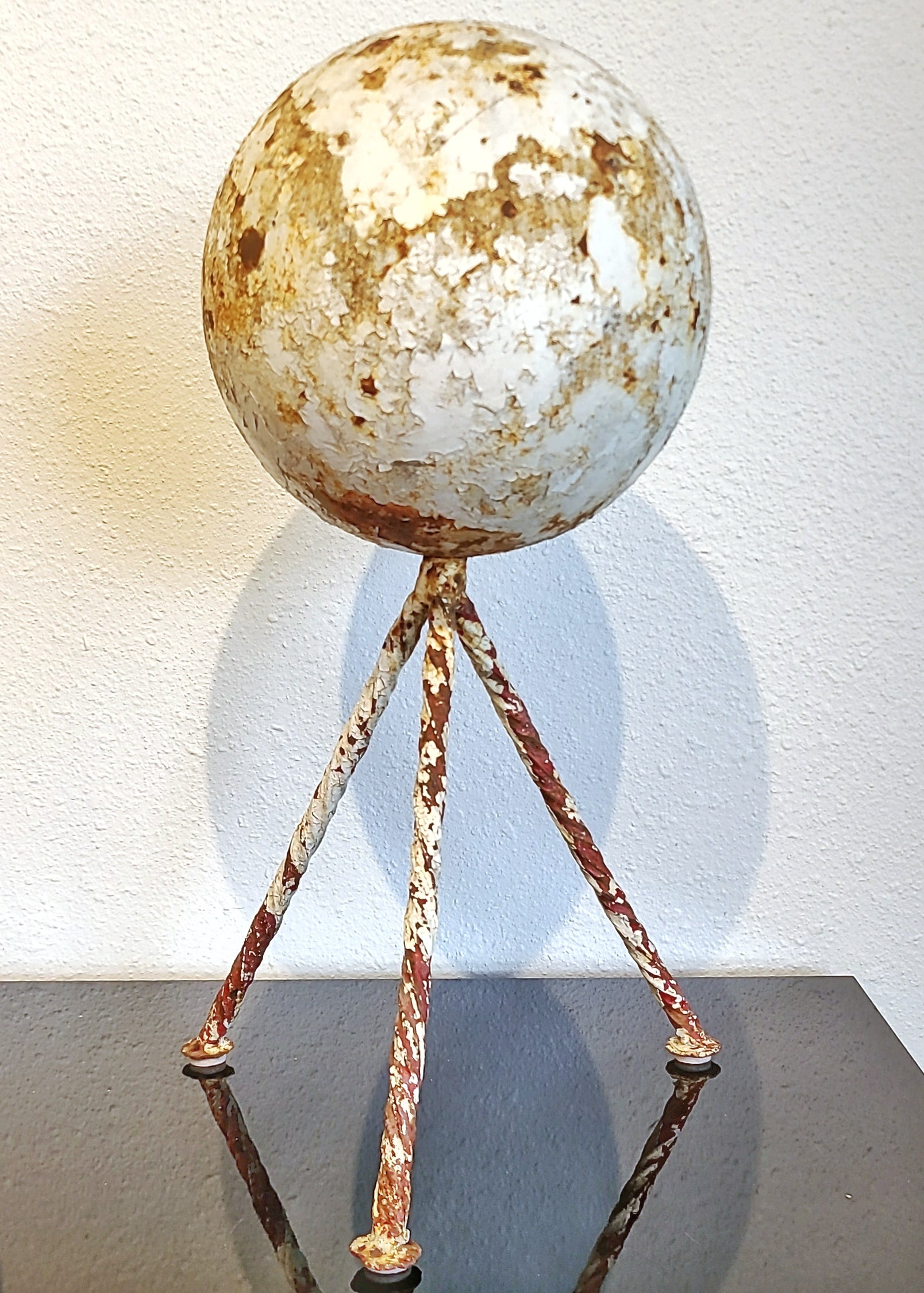 HEAVY IRON GARDEN SPHERE ON TWISTED IRON TRIPOD BASE (1940s)