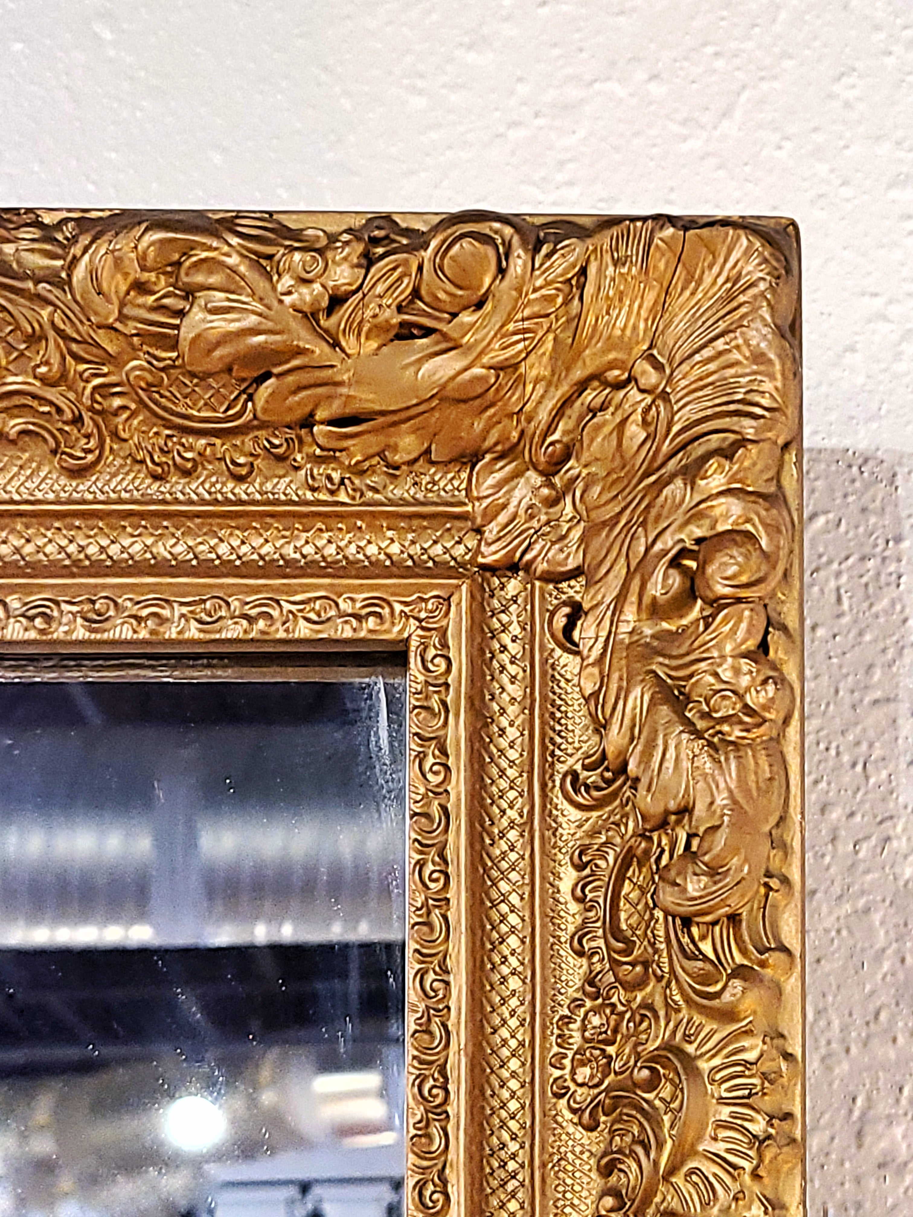 LARGE MIRROR IN A LATE BAROQUE/ROCOCO STYLE GILT FRAME