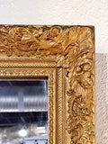 LARGE MIRROR IN A LATE BAROQUE/ROCOCO STYLE GILT FRAME