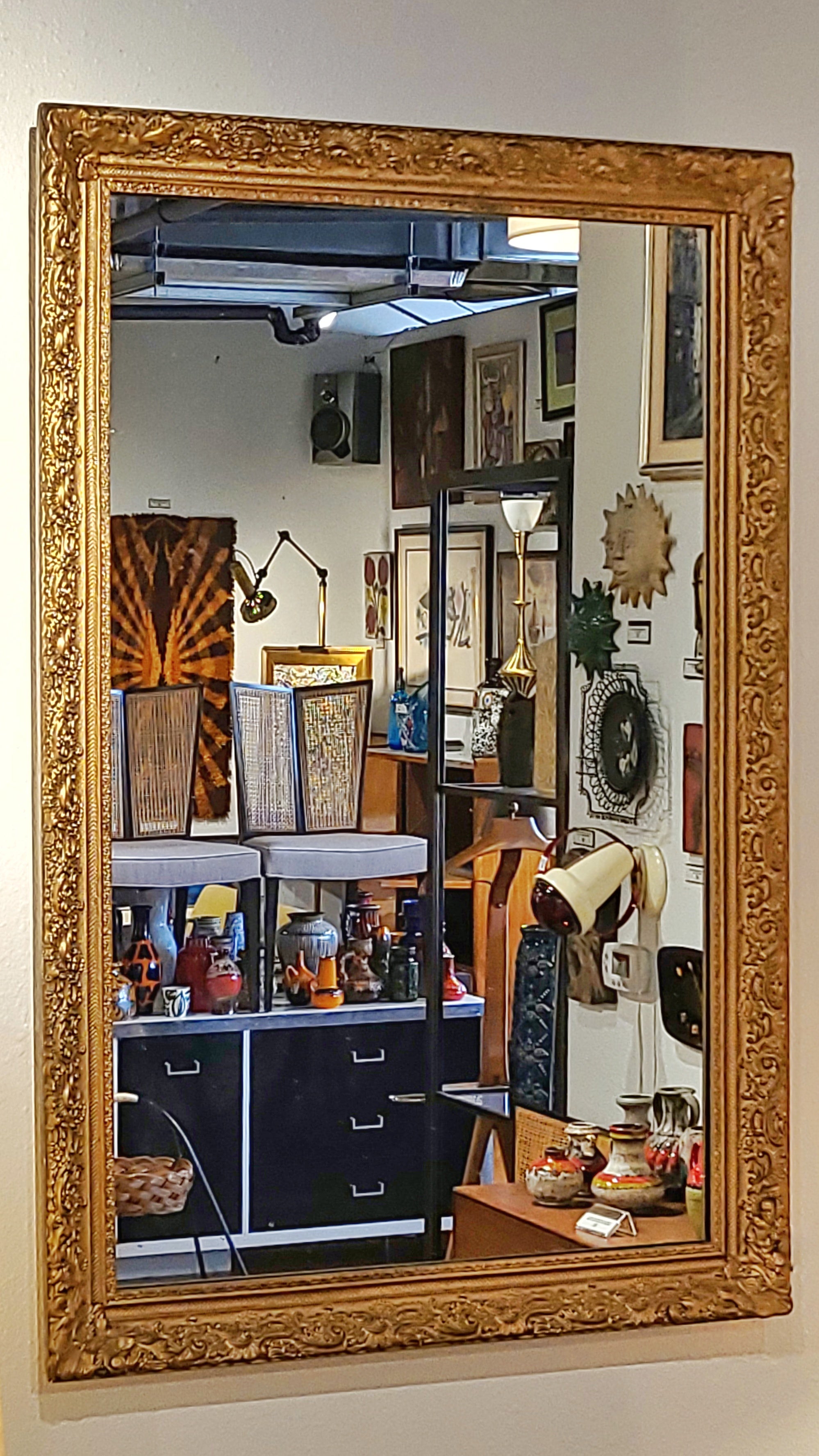 LARGE MIRROR IN A LATE BAROQUE/ROCOCO STYLE GILT FRAME