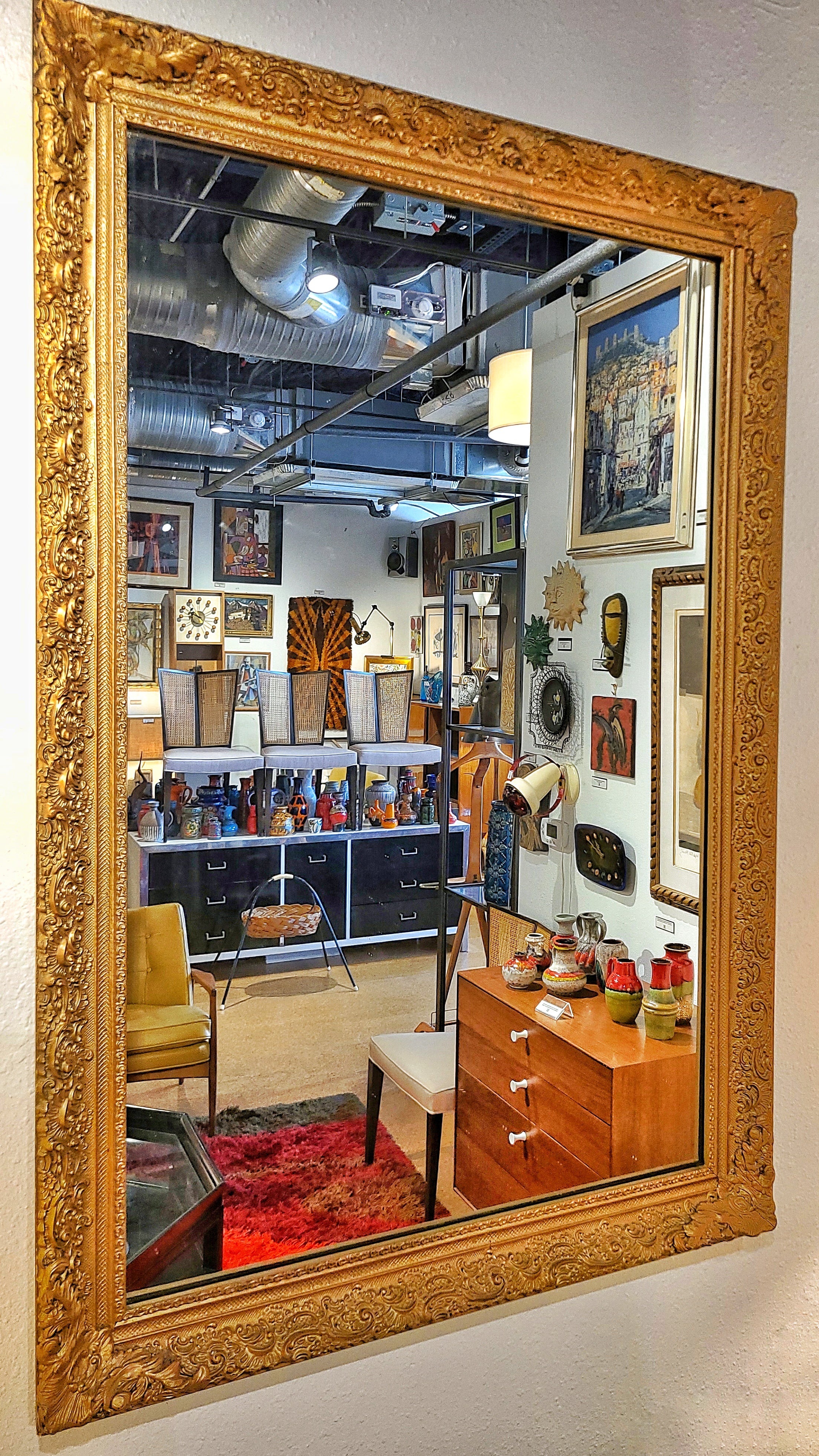 LARGE MIRROR IN A LATE BAROQUE/ROCOCO STYLE GILT FRAME