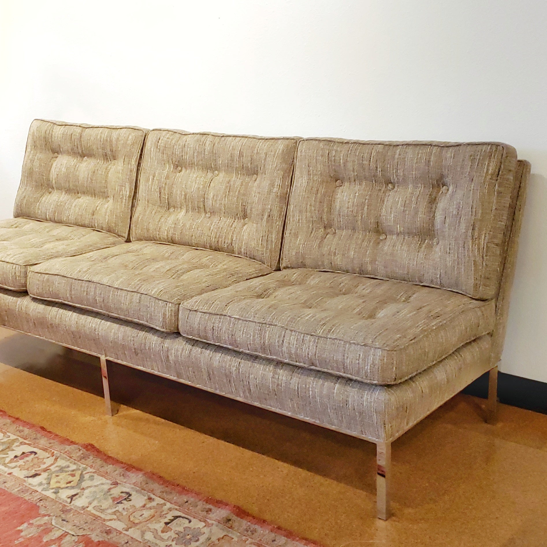 ARMLESS SOFA WITH CHROMED STEEL PLATFORM BASE