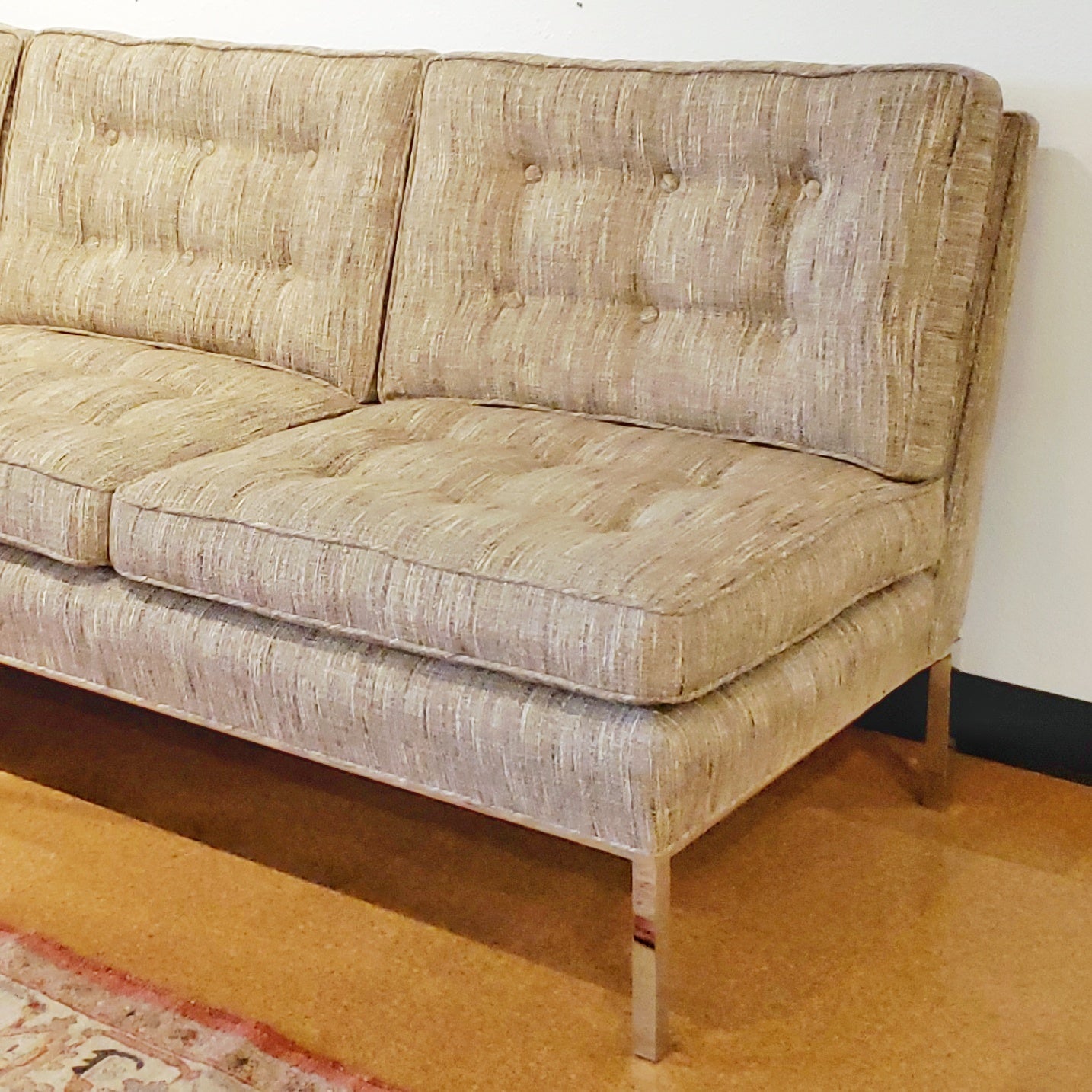 ARMLESS SOFA WITH CHROMED STEEL PLATFORM BASE