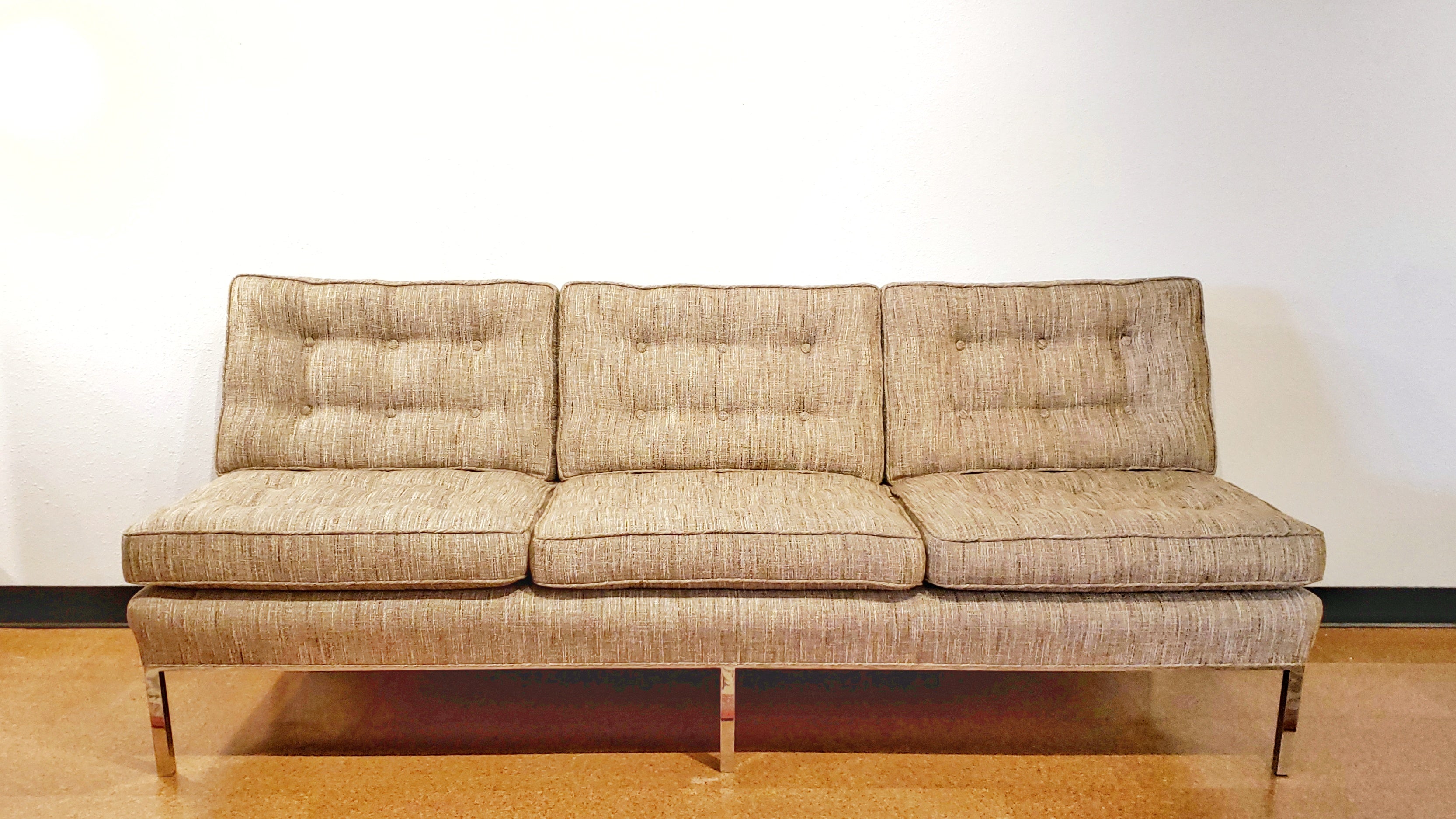 ARMLESS SOFA WITH CHROMED STEEL PLATFORM BASE