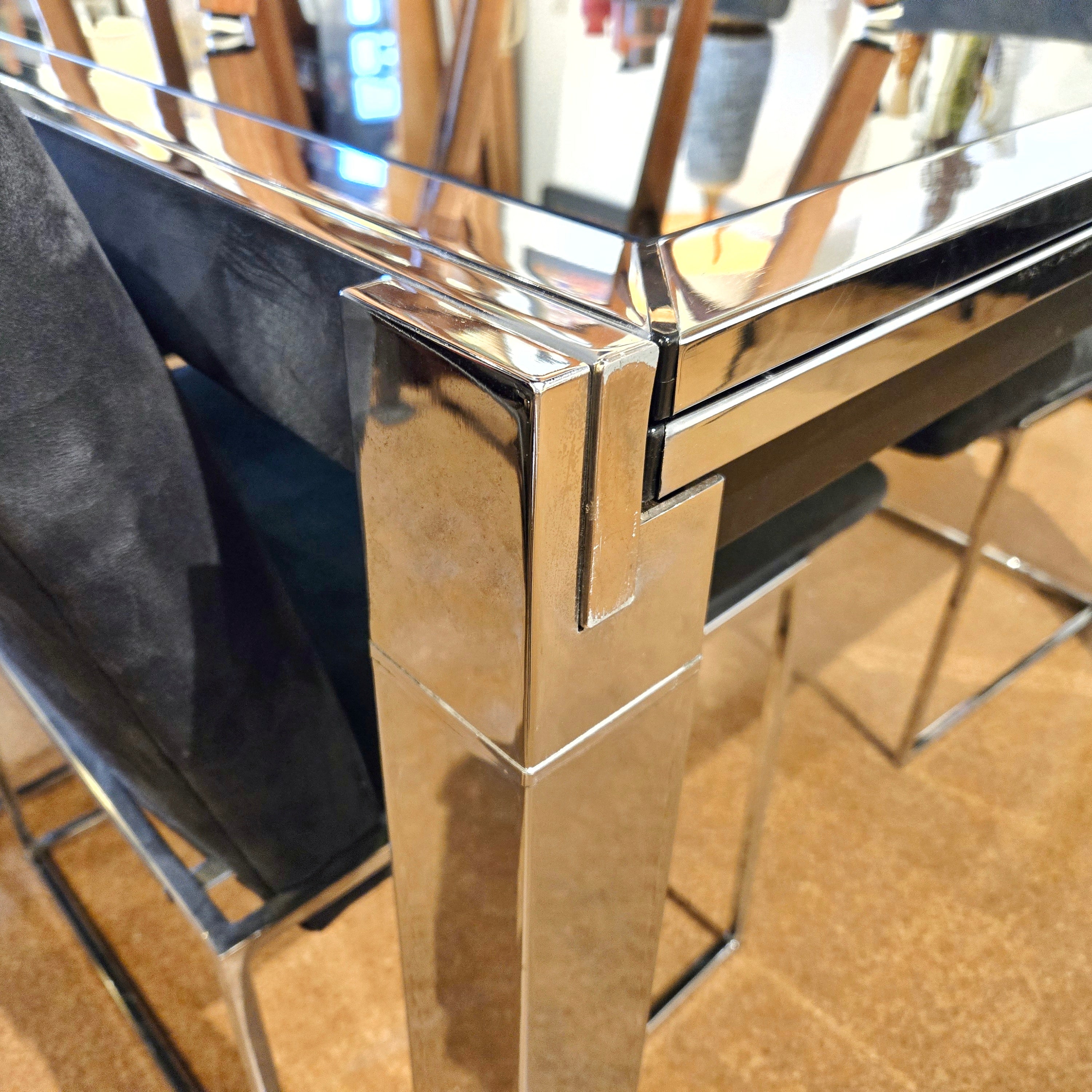 GLASS-TOP CHROMED STEEL DRAW-LEAF TABLE IN THE STYLE OF MILO BAUGHMAN