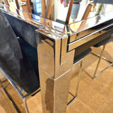 GLASS-TOP CHROMED STEEL DRAW-LEAF TABLE IN THE STYLE OF MILO BAUGHMAN