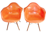 ORANGE EAMES MOLDED FIBERGLASS ‘DAW’ ARMCHAIR WITH NEW DOWEL BASE (2 AVAILABLE)