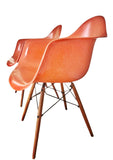 ORANGE EAMES MOLDED FIBERGLASS ‘DAW’ ARMCHAIR WITH NEW DOWEL BASE (2 AVAILABLE)