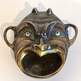 ANTIQUE BRASS DEVIL'S HEAD ASHTRAY WITH GLASS EYES