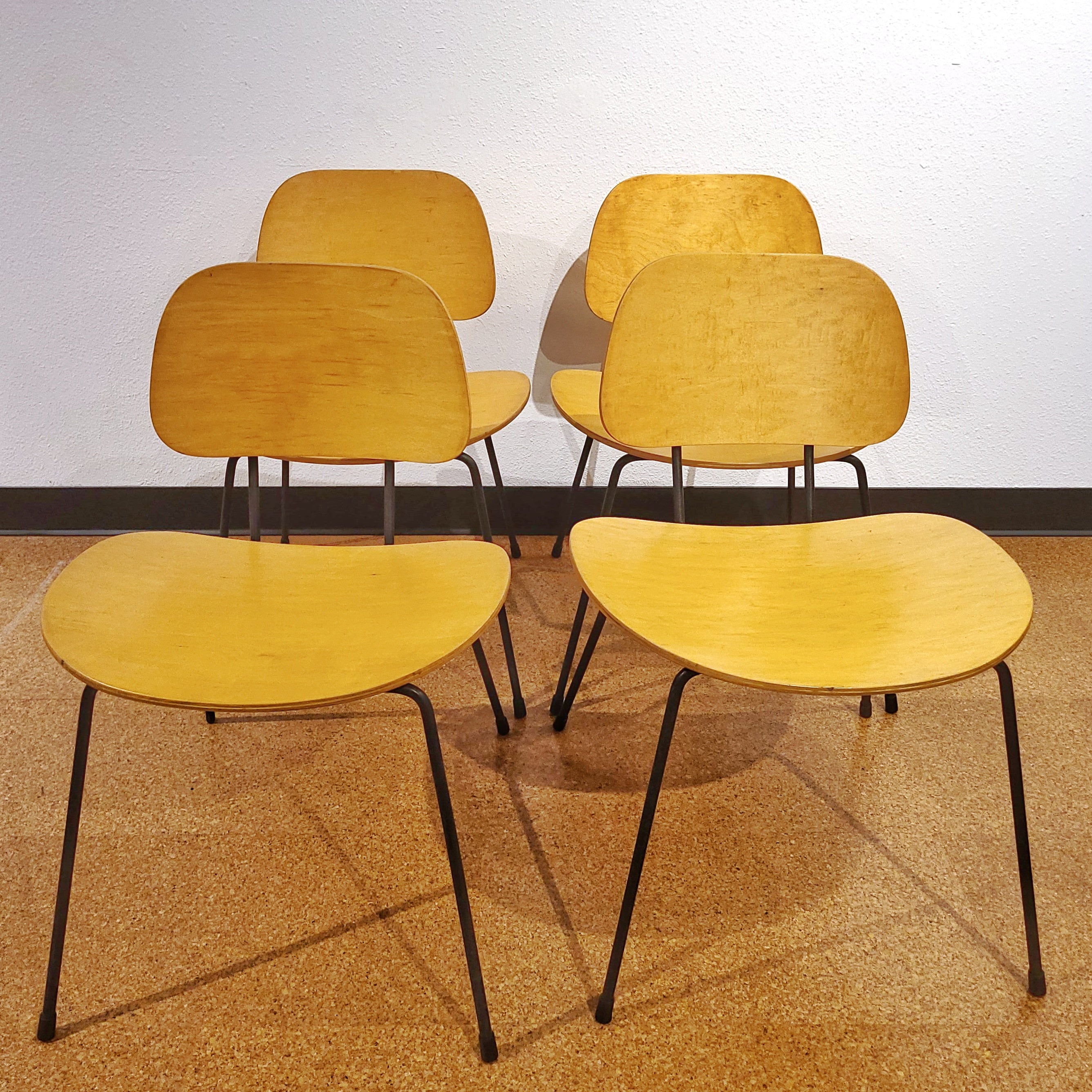 FOUR PLYWOOD AND IRON CHAIRS IN THE MANNER OF WIM RIETVELD