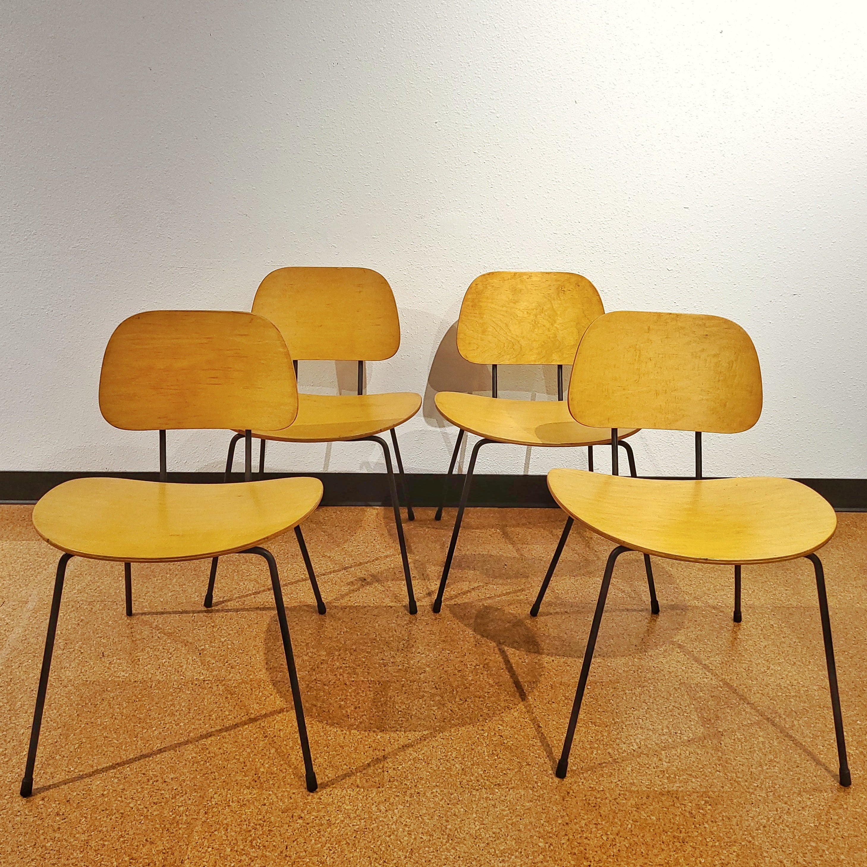 FOUR PLYWOOD AND IRON CHAIRS IN THE MANNER OF WIM RIETVELD