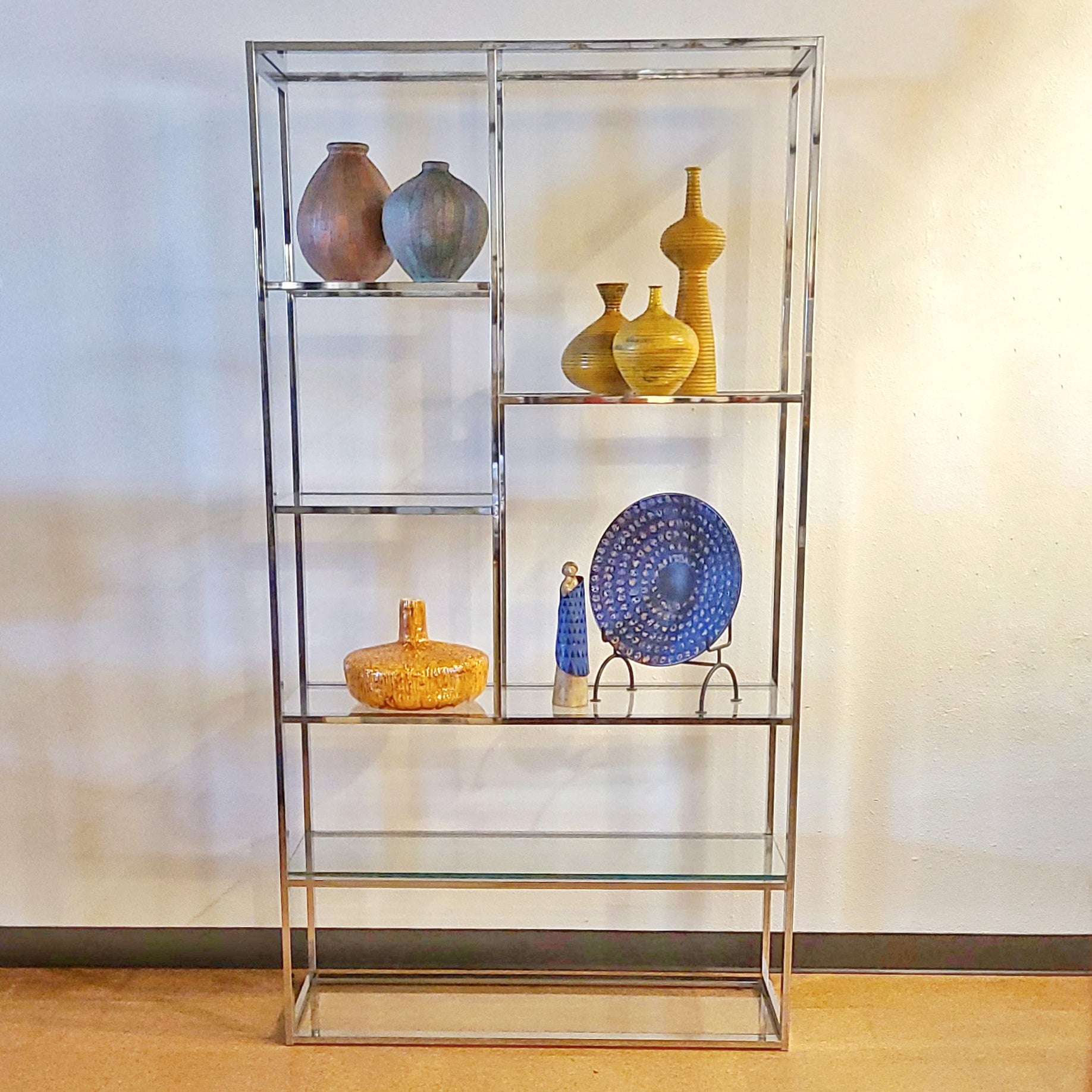FLAT BAR CHROME AND GLASS ETAGERE IN THE MANNER OF MILO BAUGHMAN