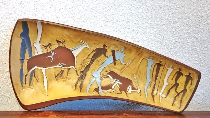 ASYMMETRICAL TRIPOD BOWL WITH PREHISTORIC HUNTING SCENE